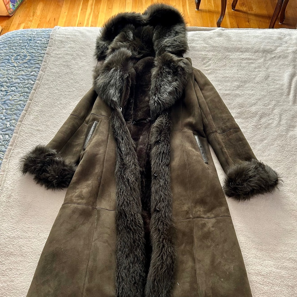 Super warm, hooded full-length shearling coat.